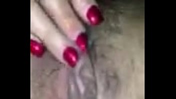 Florence Dixon spreading wide and fingering a hairy dripping pussy