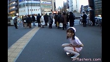 Naughty Asian girl is pissing in public